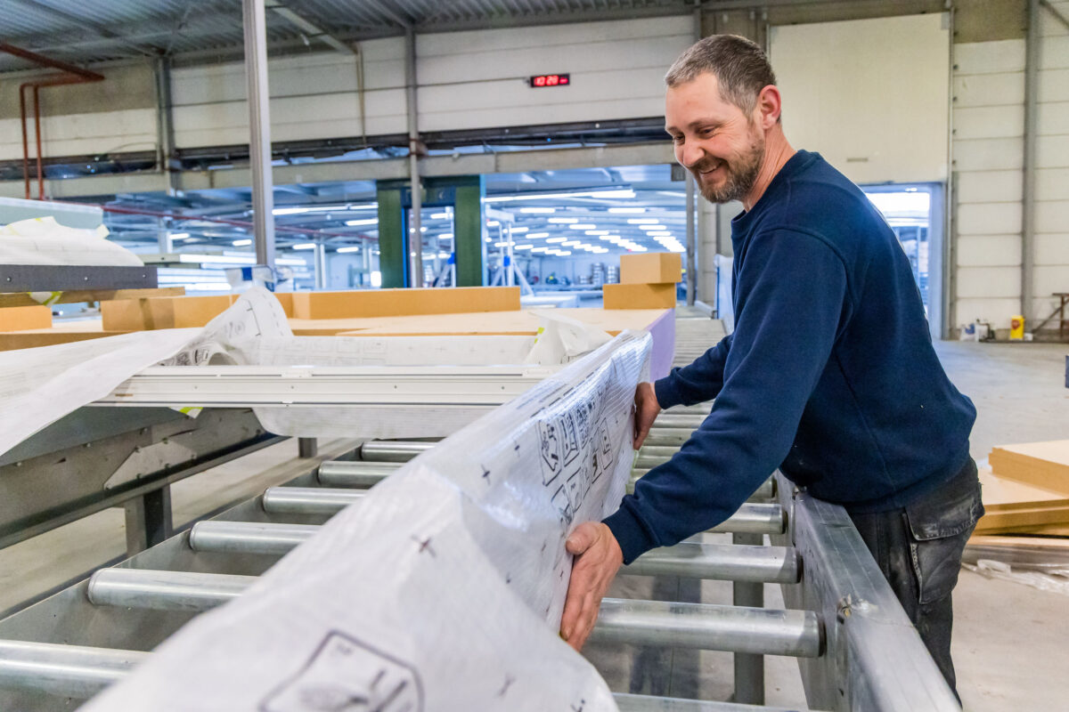 Team member assembling panels in beSteel's offsite construction factory.